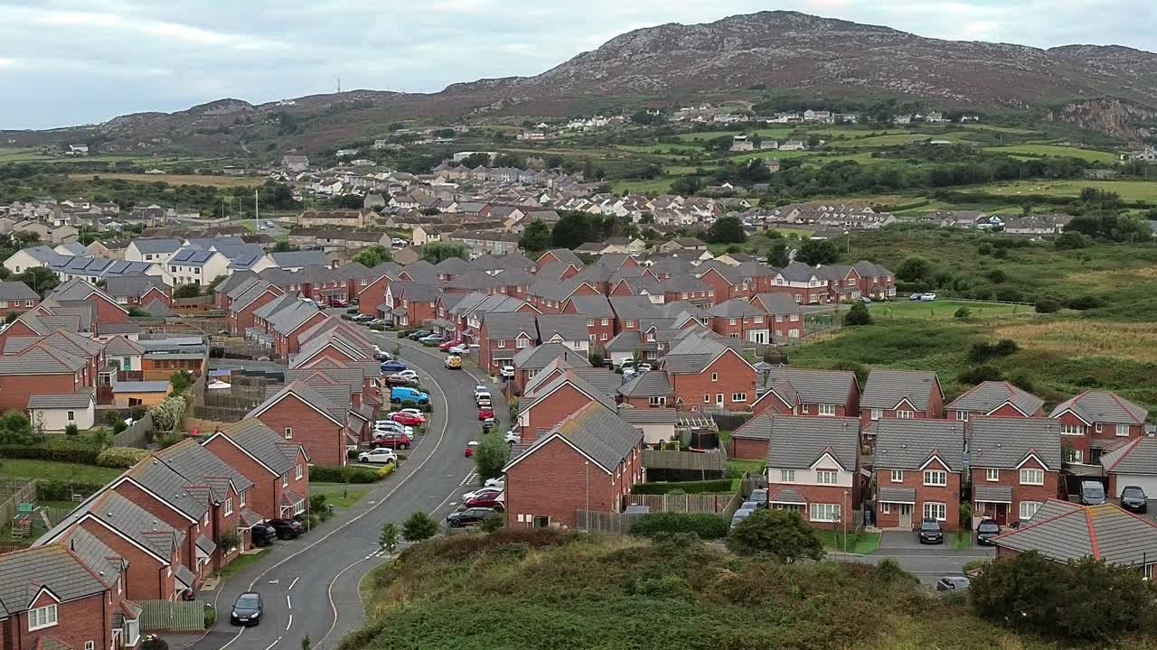 Holyhead homes aerial view overlooking peaceful early morning residential housing and Welsh mountain