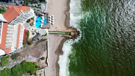 aerial top down of oceanfront beach resorts and hotels on the puerto vallarta coastline in mexico