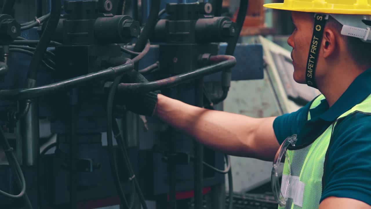 Smart factory worker using machine in factory workshop