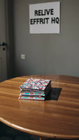 stack of books on a wooden table in a modern office