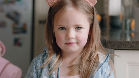 portrait beautiful little girl wearing cute cat ears having fun at home playing dress up enjoying childhood imagination