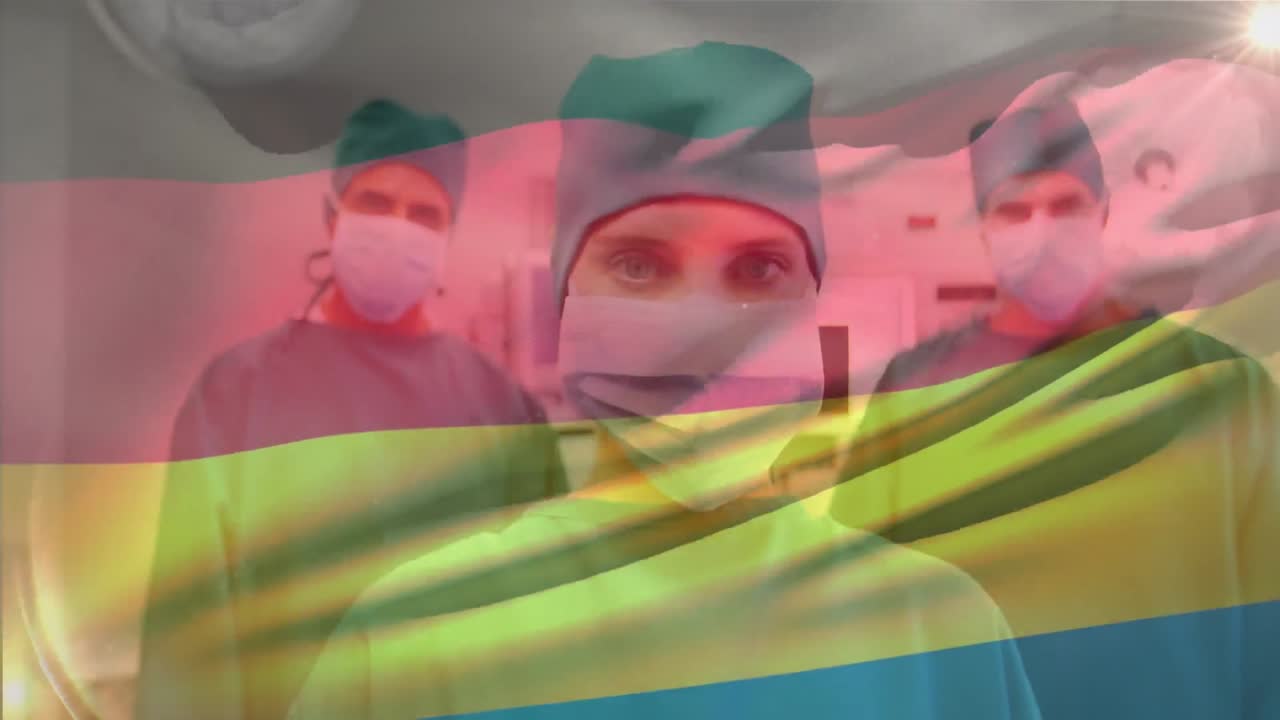 animación de ondear la bandera de alemania contra el retrato del equipo de diversos cirujanos en el hospital