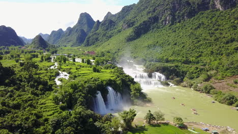stunning view of cascading ban gioc waterfalls under bright blue sky