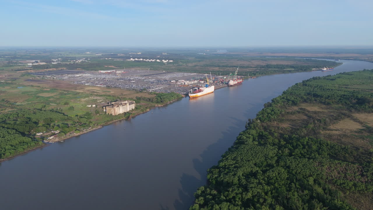 Aerial view of cargo ships moored at Terminal Zárate Port on Paraná River, Argentina