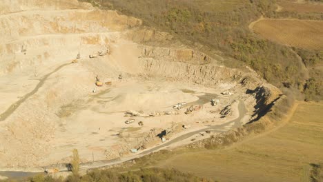 aerial view of an active quarry with mining equipment