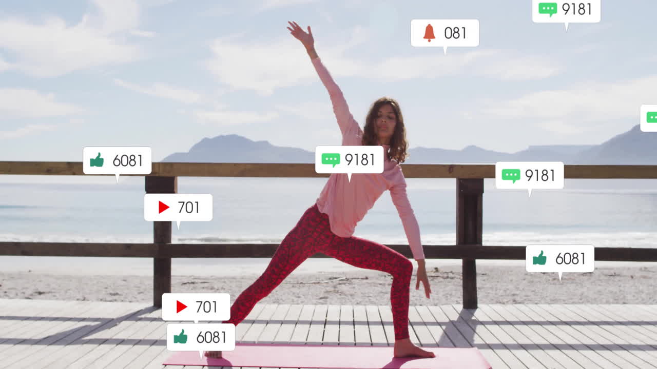 woman practicing yoga on deck by beach, with animated tech icons showing likes comments
