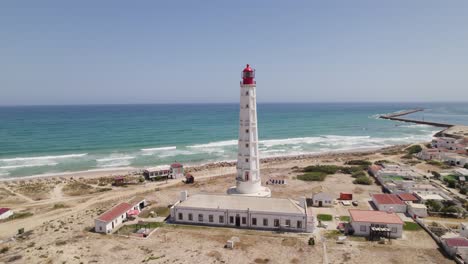 cabo de santa maria lighthouse in olhão, portugal, aerial orbit, summer day