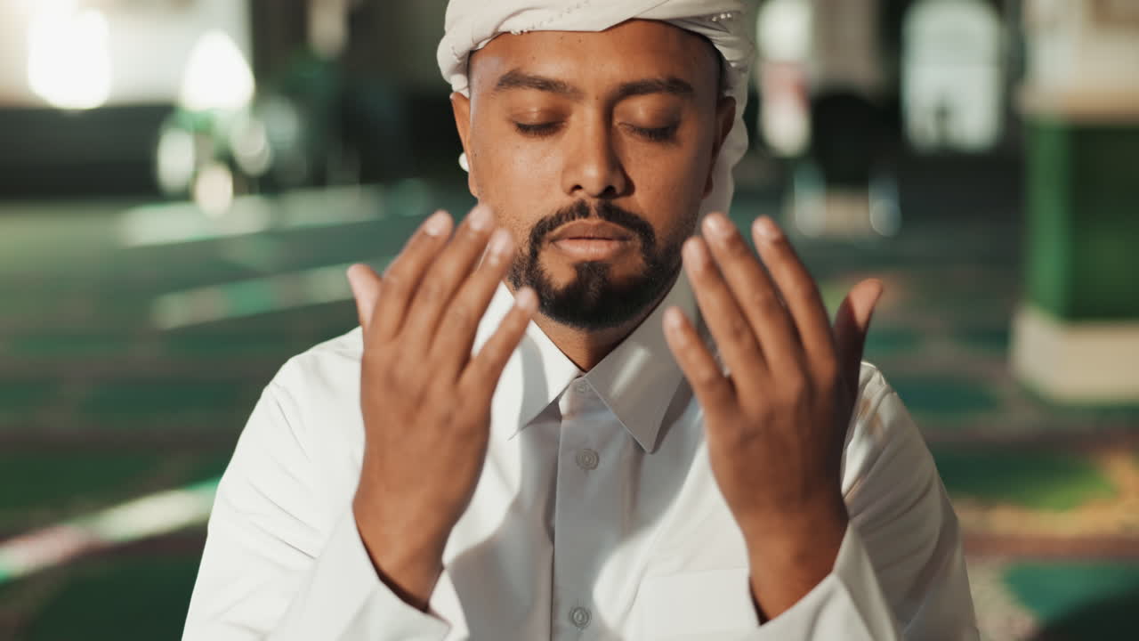Muslim man praying in a mosque