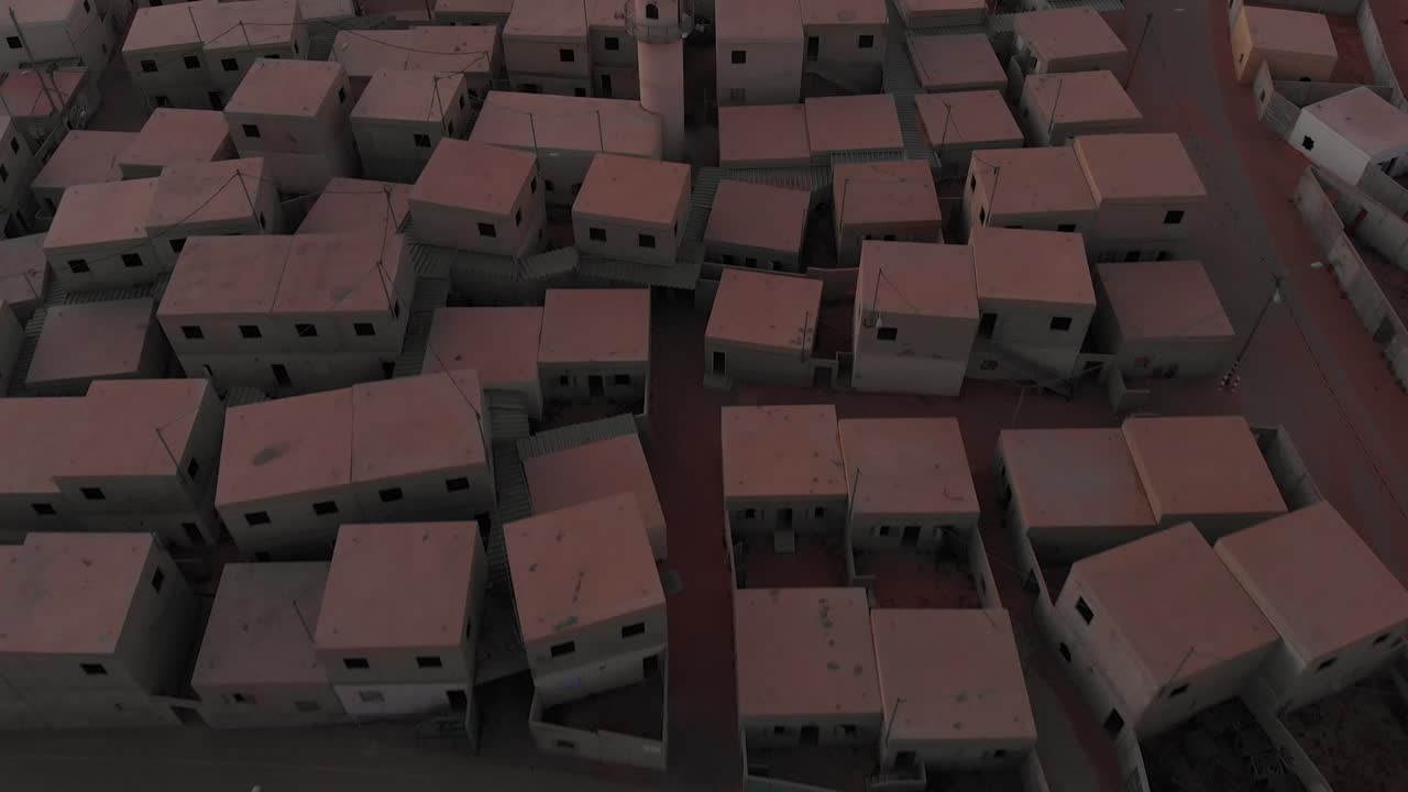 fast aerial drone movement above old empty arabic city in the desert at morining