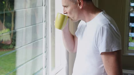 man having coffee at home 4k