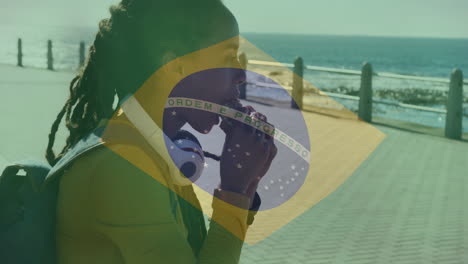 walking along seaside promenade, person with brazilian flag overlay animation