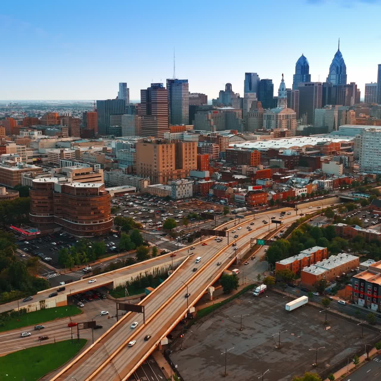 Various cityscape of Philadelphia at sunset. Footage above the highways with cars moving by. Top view