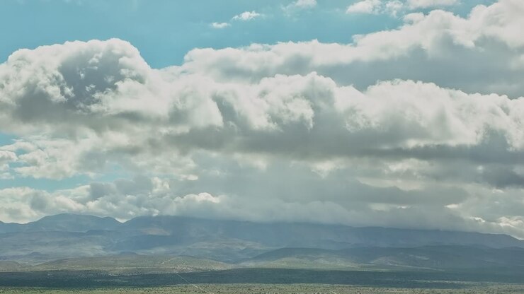 Sky over mountains in the USA shows clouds and clear blue areas