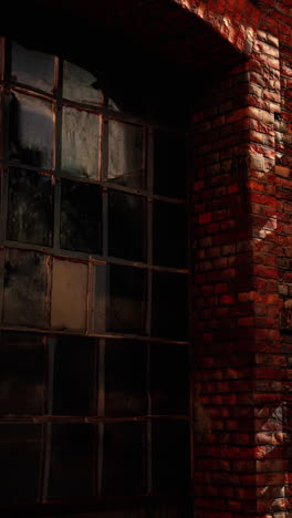 close-up of a red brick wall with a large window