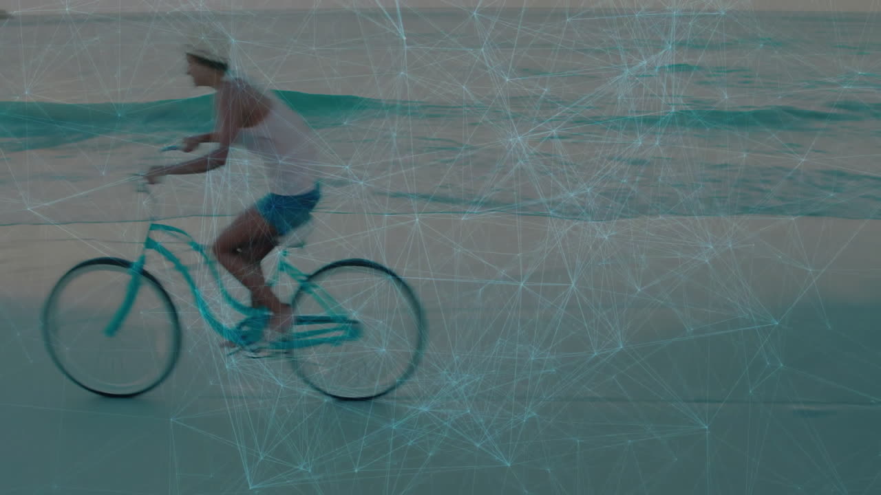 Person riding bicycle on beach with network connections animation overlay