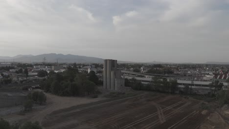 overflight in cuautitlan mexico, in front of destroyed silos