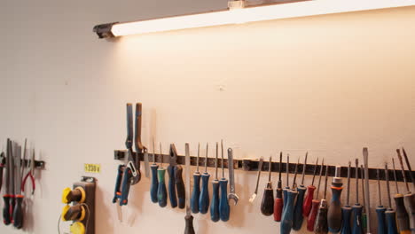 Close-up-of-electric-router-on-wood-shaper-in-carpentry-studio