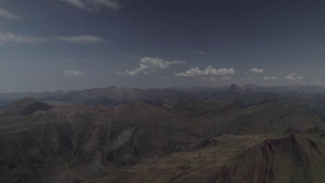 this drone video features a stunning descending crane shot over the majestic pico del castillo d’acher in the aragonese pyrenees, spain, showcasing its rugged beauty and breathtaking mountain scenery.