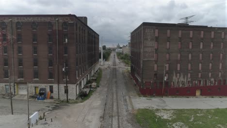 Aerial-in-between-two-warehouse-in-downtown-St