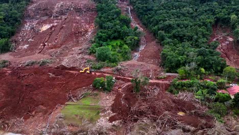 Nature-destruction,-uprooted-vegetation-and-trees,-terrain-damaged,-aerial