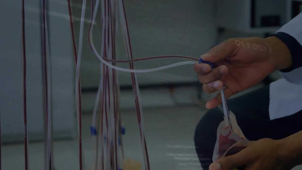 Scientist Handling Blood Bag in Laboratory with Digital Data Overlay