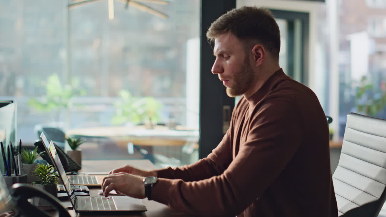 Serious manager reading documents in workspace closeup. Accountant working desk