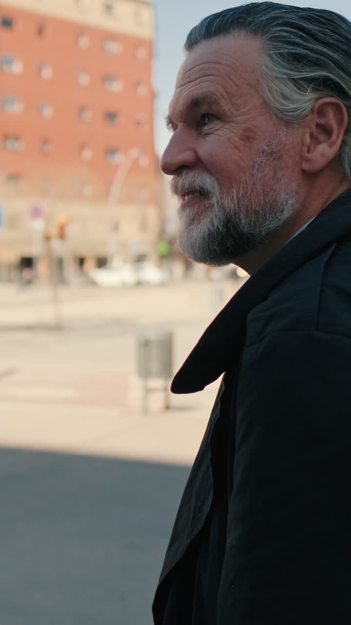 Gray Haired Man Walks Down City Street