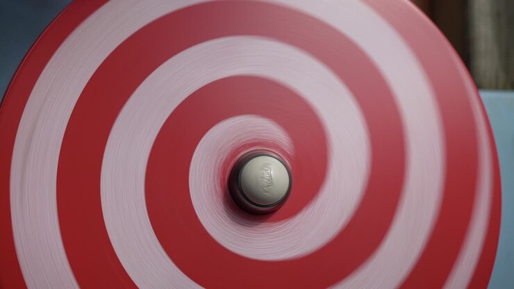 Hypnotic spinning disk wooden object at kid playground