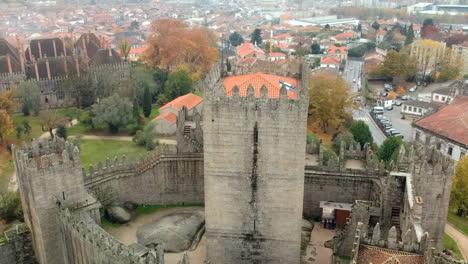 aerial view of guimarães castle over the city