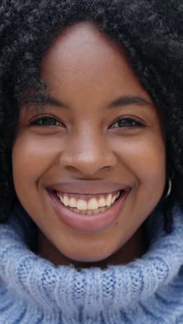 beauty african young woman smiling at camera outdoors