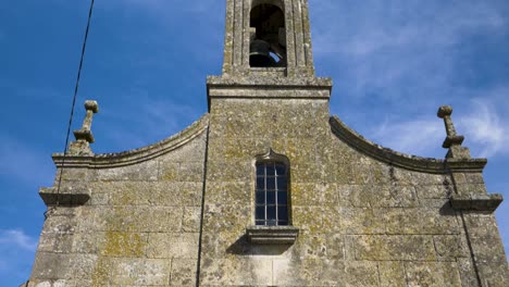 tilt up view of san tomé de morgade facade church, xinzo de limia ourense, galicia, spain