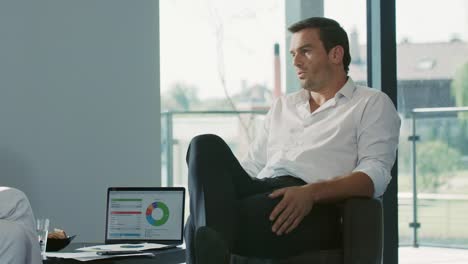 business man working with colleague in house. male professional talking to woman