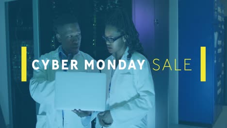 Animation-of-cyber-monday-sale-text-over-african-american-male-and-female-engineers-using-laptop