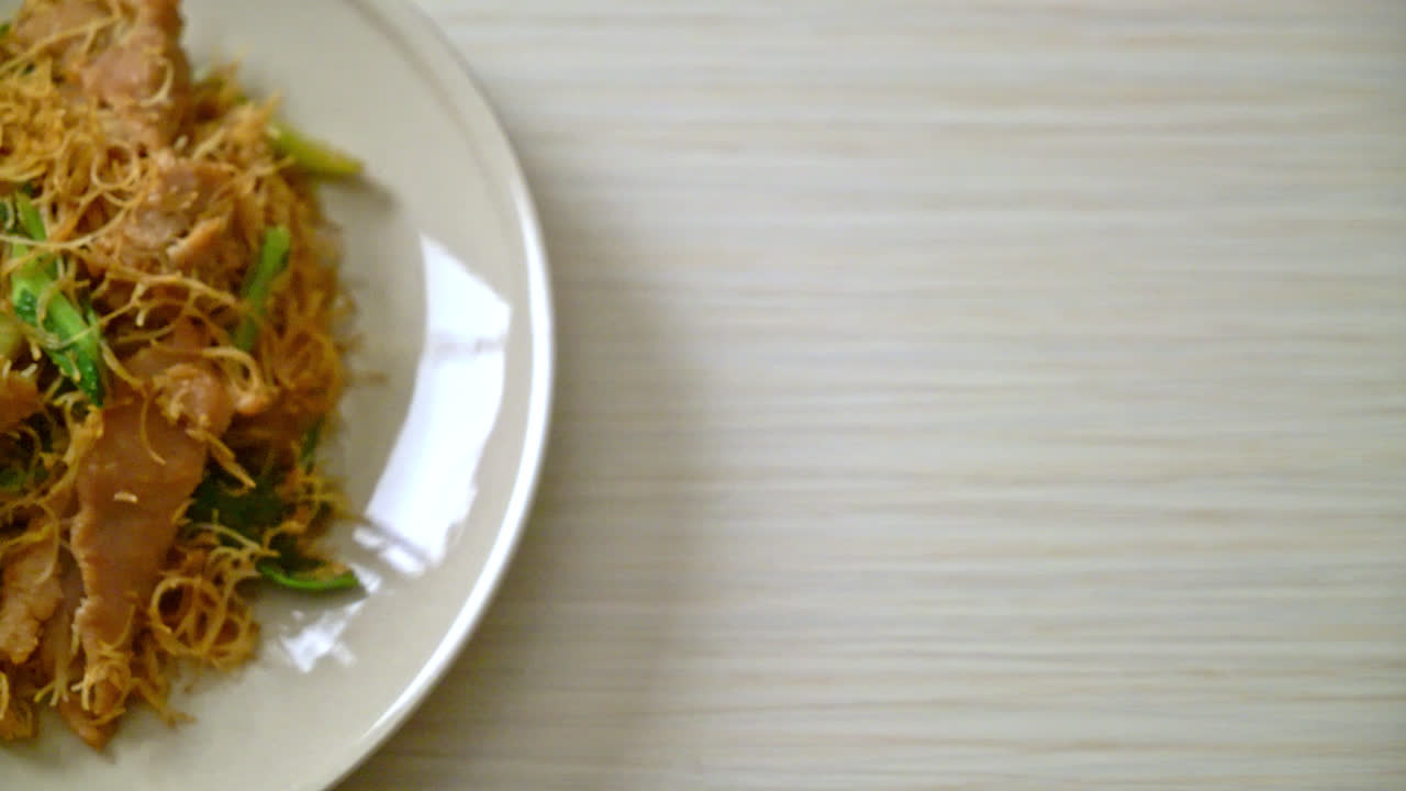 Stir fried rice vermicelli noodle with black soy sauce and pork - Asian food style