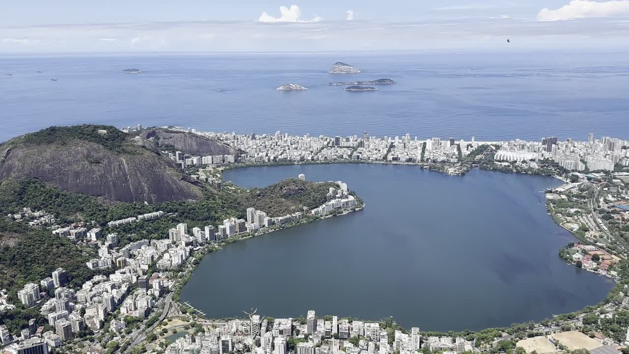 Mountainous city view with coastal backdrop