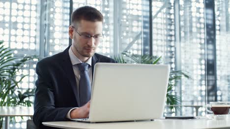 handsome businessman working on laptop