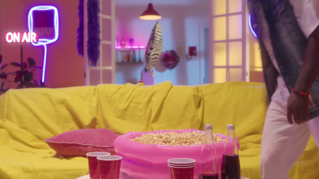 Man relaxing on a couch with popcorn