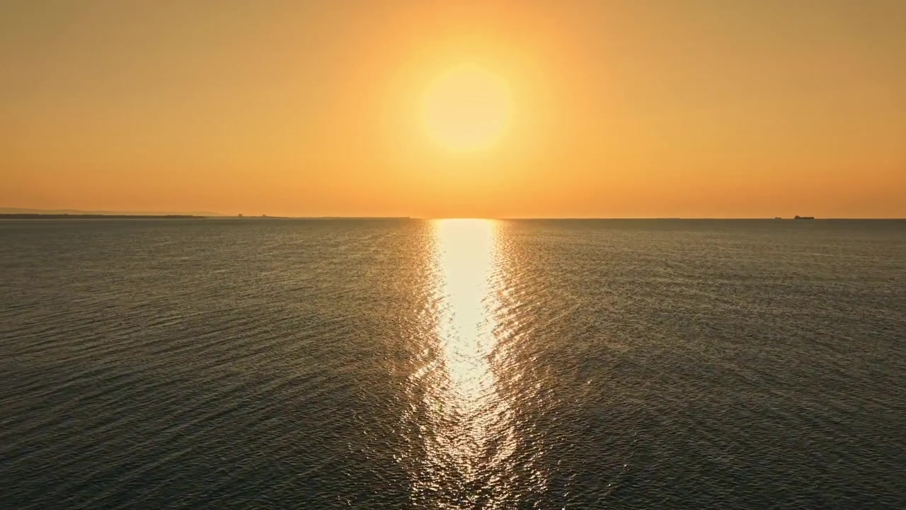 Sunset over the ocean with golden light reflecting on the water surface during evening hours