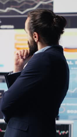 vertical video businessman thinking about a new solution to increase funding