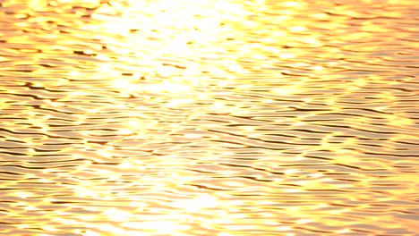 Golden screen background of wave water motion from sunset sunny surface pond background, abstract colorful wallpaper for creative graphic design, sun light reflect on water is beauty nature background
