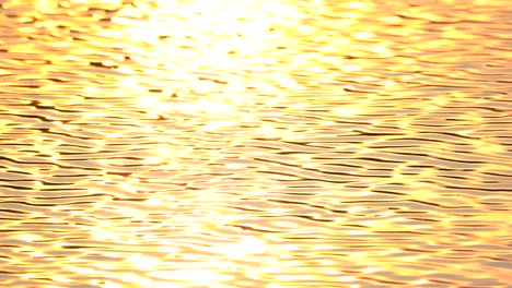 golden screen background of wave water motion from sunset sunny surface pond background, abstract colorful wallpaper for creative graphic design, sun light reflect on water is beauty nature background