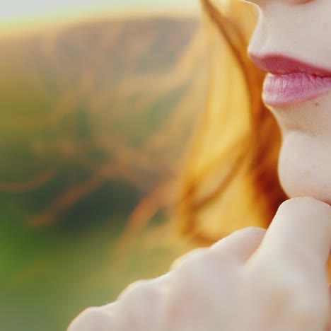 A-Pensive-Woman-Is-Standing-At-Sunset-Close-Up