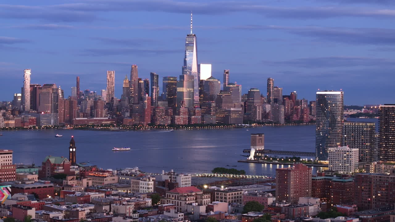 Aerial view of Lower Manhattan at night. Shot in Hoboken, New Jersey with the World Trade Center and the East River in the background.