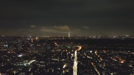 From-above,-the-city's-lights-dance,-and-the-Eiffel-Tower-casts-its-glow-over-th