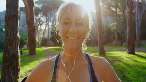 senior woman smiling in the park 4k