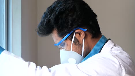 scientist looking through window