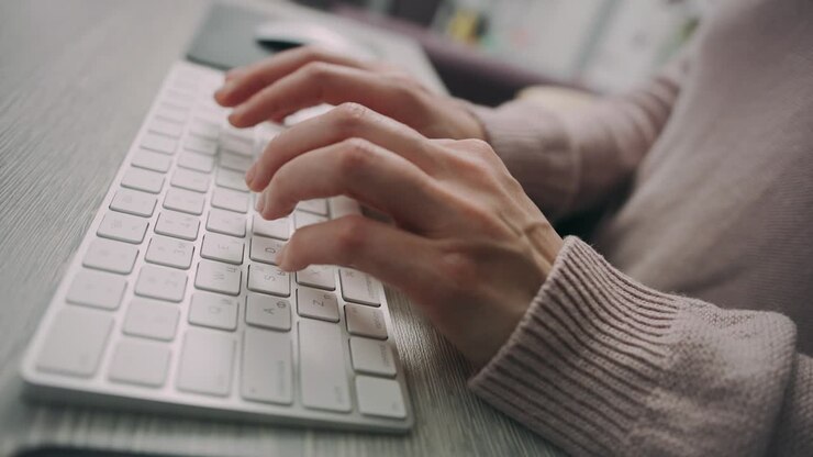 Female hands working on keyboard. Female programmer working on computer keyboard