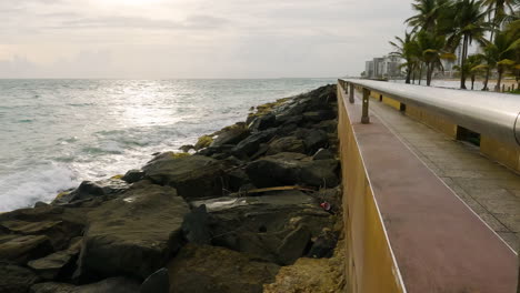 waves crashing on rocky coast of san juan, puerto rico