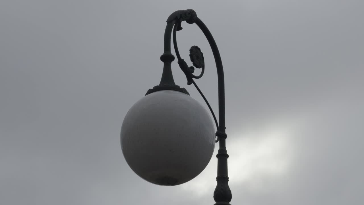 Street Light With White Glass And Beautiful Black Decorations Cloudy Sky