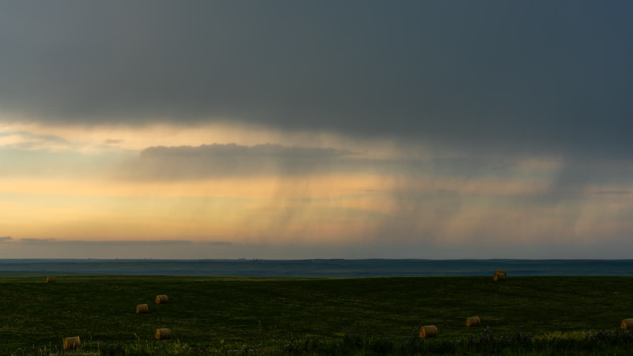 Rain shower drifting across a colorful sky time lapse